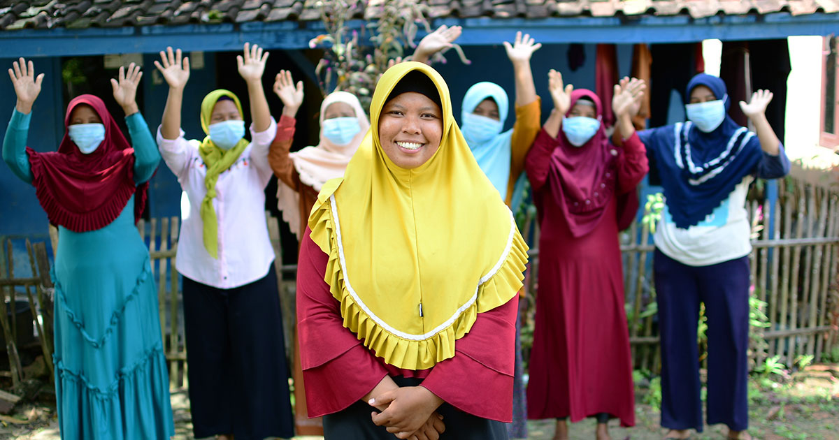 Tarsini and her community members in Indonesia