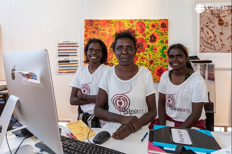 Janice with her daughters in the shop at Djilpin Arts in Northern Territory, Australia. Photo credit: Richard Wainwright/Caritas Australia. 