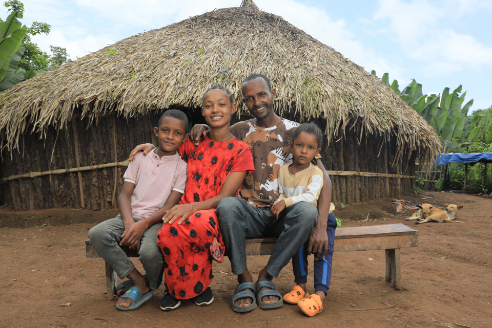 Yeshareg With Her Family Outside Their Family Home
