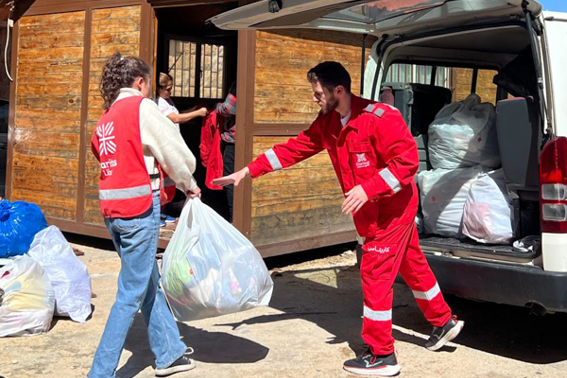 Caritas Lebanon aid workers distributing emergency supplies_1.jpg