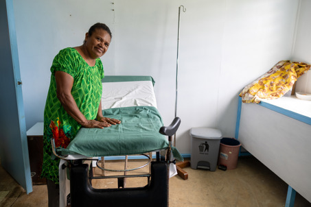 Participant standing near maternity ward bed. Photo credits Caritas Australia.jpg