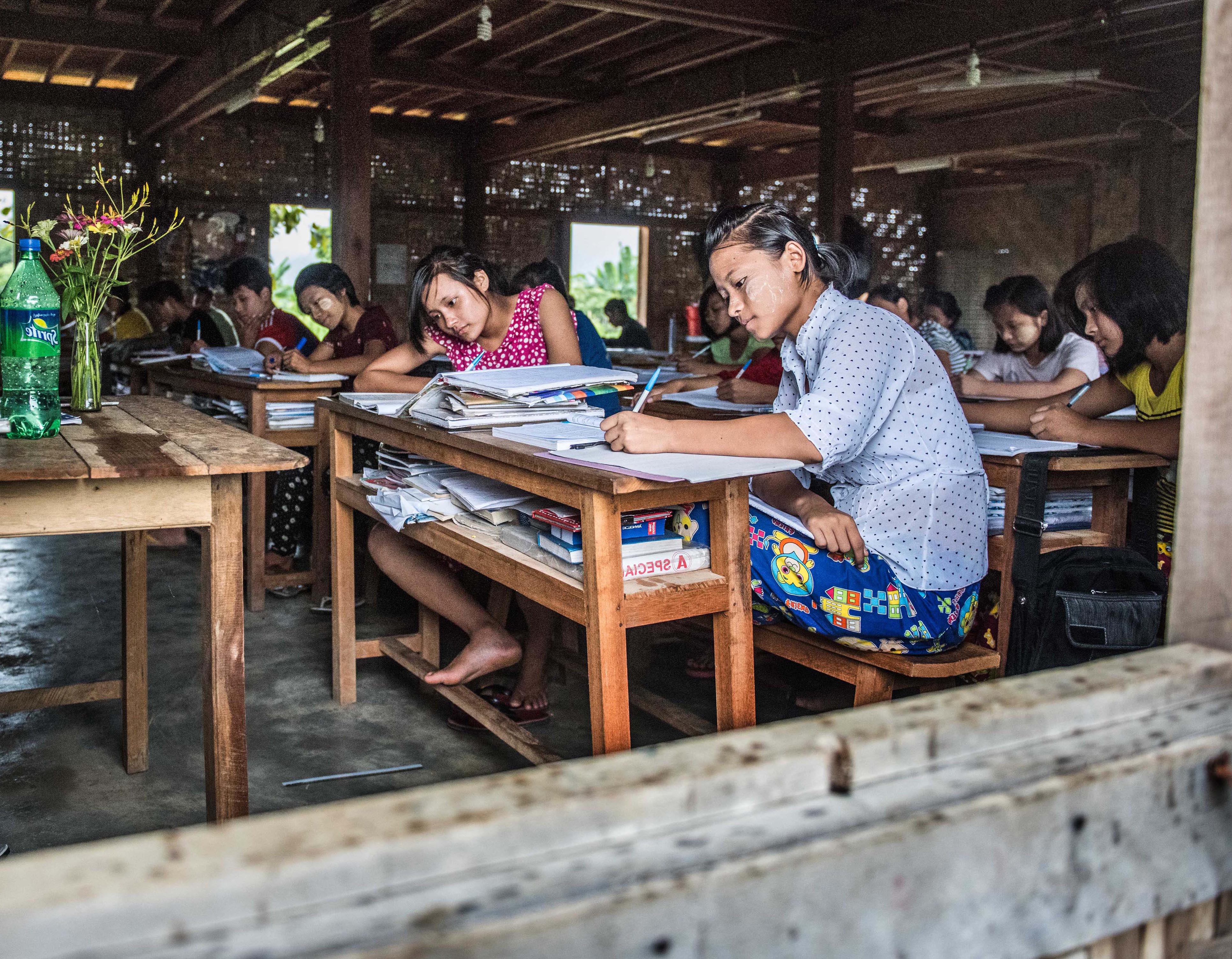 Students revise at a refugee camp school in Myanmar
