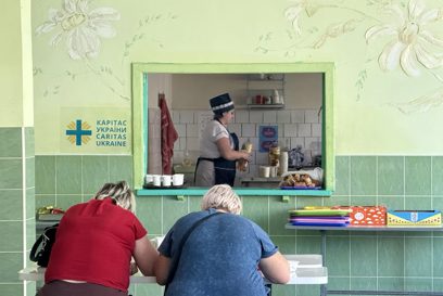 People eating at a Caritas Ukraine canteen photo credit Caritas Ukraine