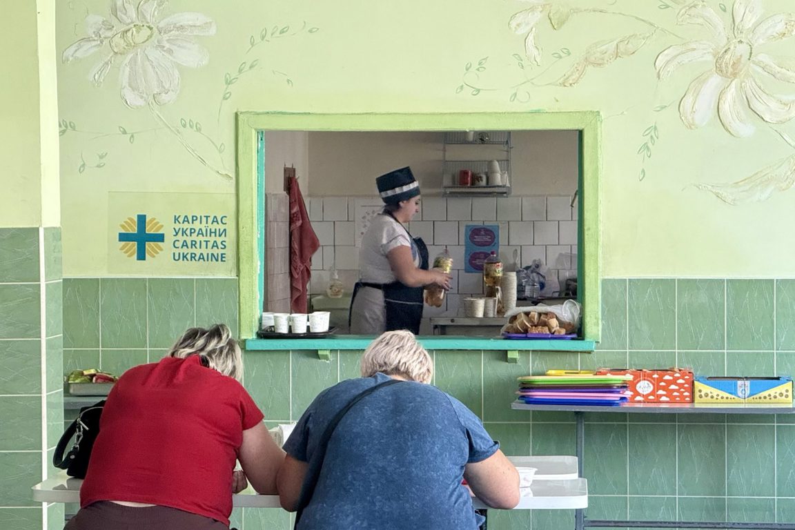 People eating at a Caritas Ukraine canteen photo credit Caritas Ukraine