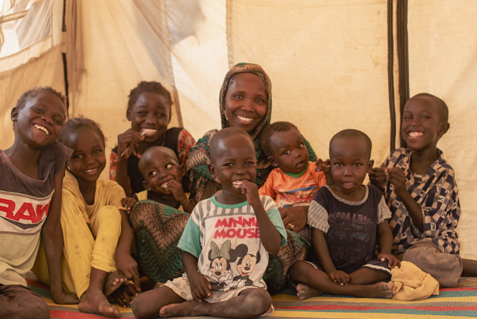 Nadia and her family in a camp in Sudan. Photo credit: George Wambugu/CAFOD (3)