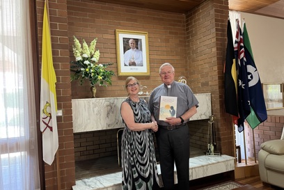 Kirsten Sayers CEO Of Caritas Australia Hands The Prayers To His Excellency Archbishop Charles Daniel Balvo Apostolic Nuncio To Australia Photo Credit Caritas Australia
