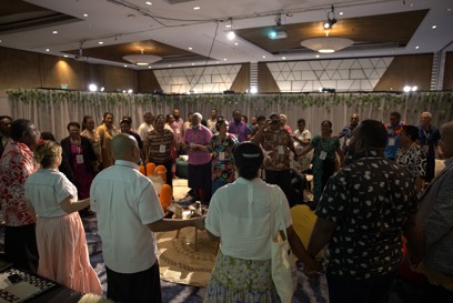 Archbishop Peter Loy Chong Lead Attendees In Song To End The Threads Of Witness Talanoa Photo Credit Caritas Australia