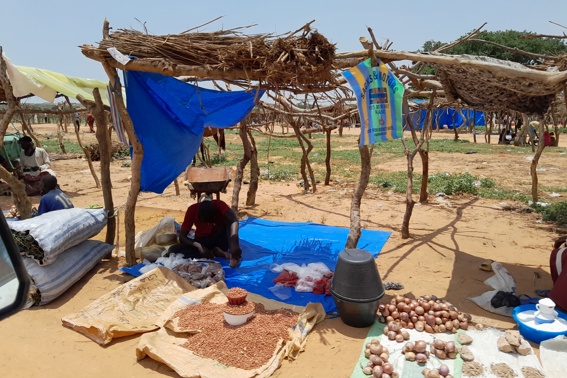 A Man Seeks Shade At A Transit Camp For Sudanese Refugees Receiving Aid Photo Credit Caritas Mongo