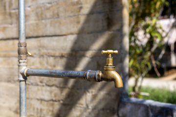 A new water tap outside Patricia's home. Photo: Caritas Australia