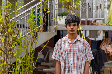 Reaksmey Outside His Home In Cambodia
