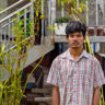 Reaksmey Outside His Home In Cambodia
