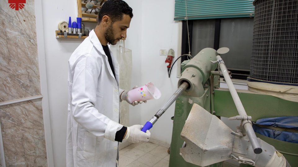 A Specialist Works On A Prosthetic Socket For A Small Child Photo Credit Caritas Jerusalem