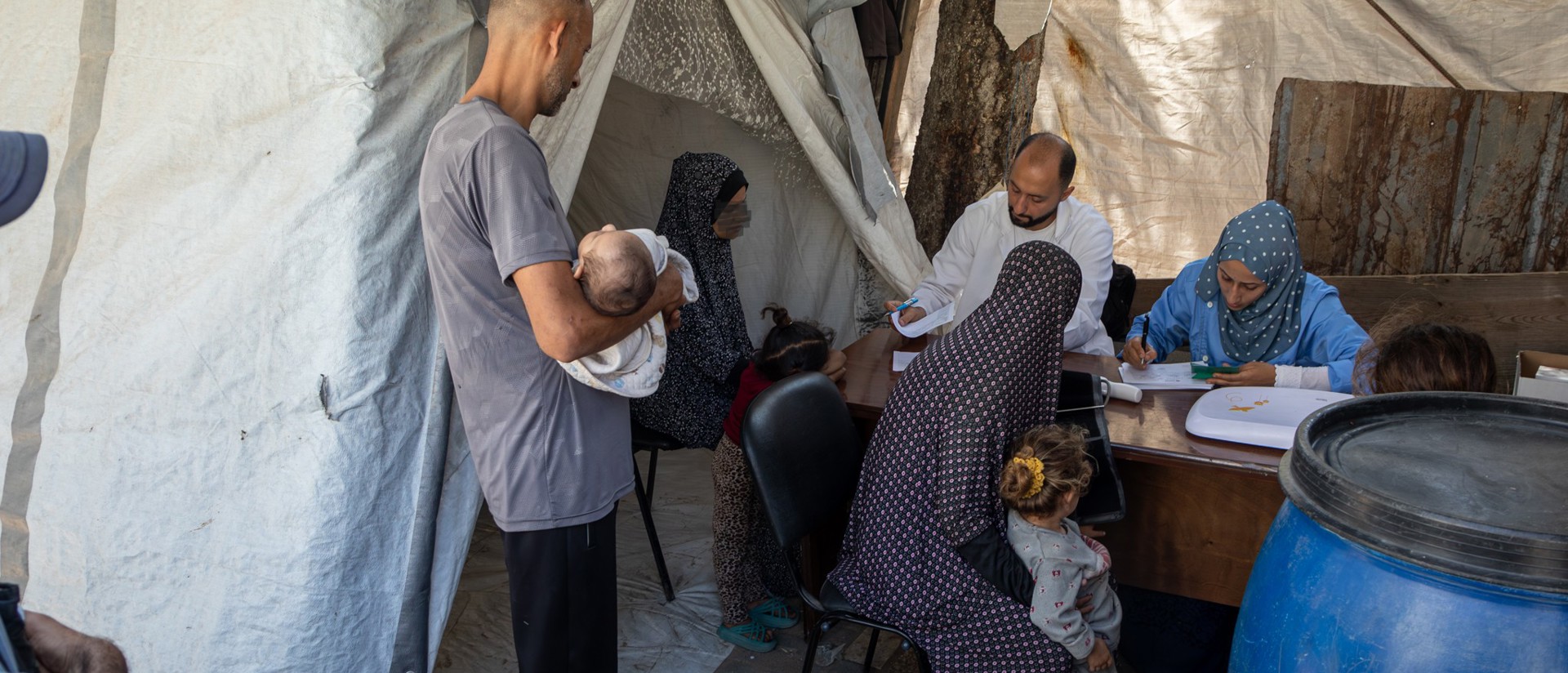 A Family Receives Humnaitarian Support In Gaza Photo Credit Caritas Jerusalem