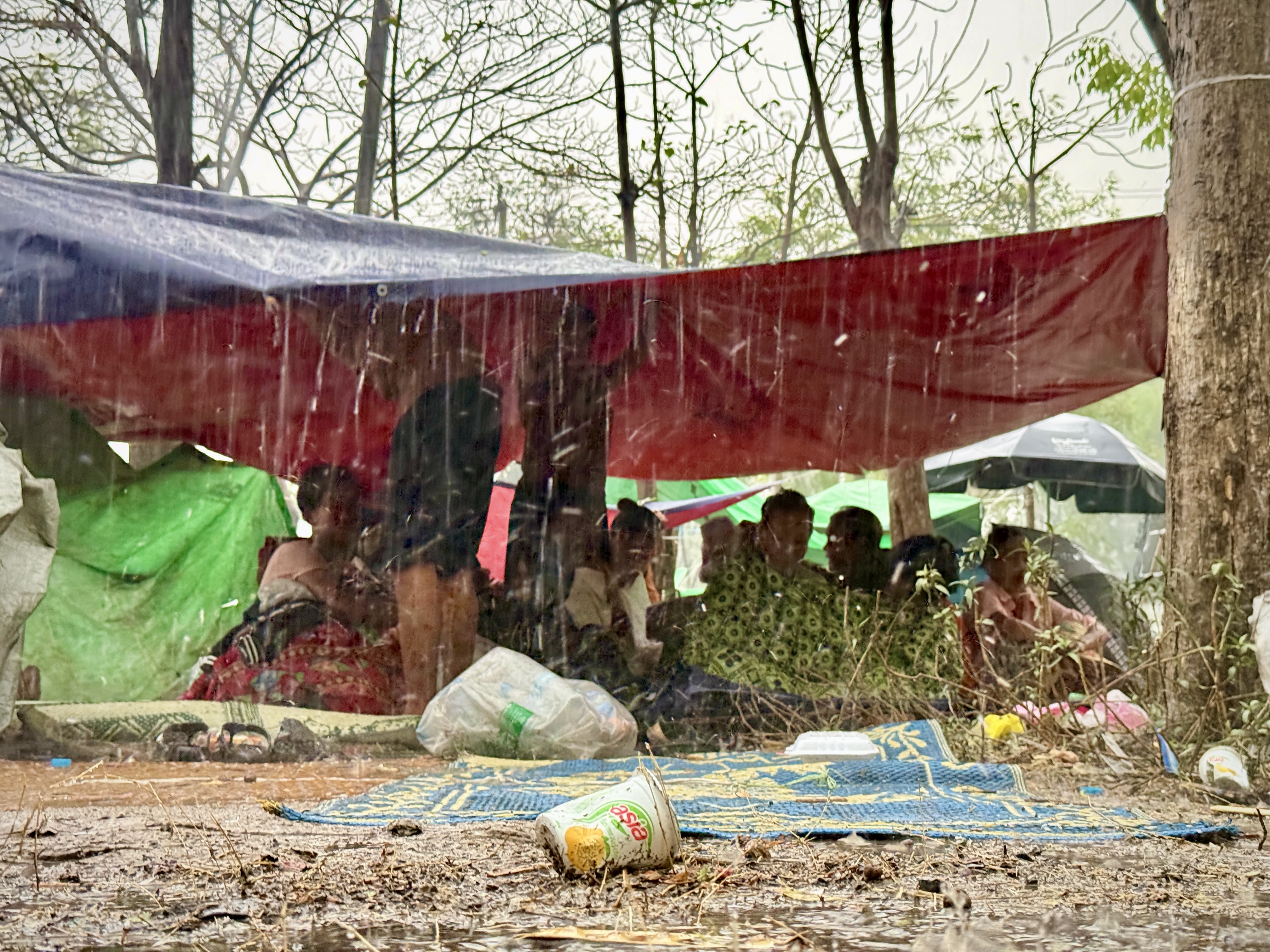 Families Shelter From The Rain Under Tarps Following The Myanmar Earthquake Photo Credit Benny Manser For Caritas