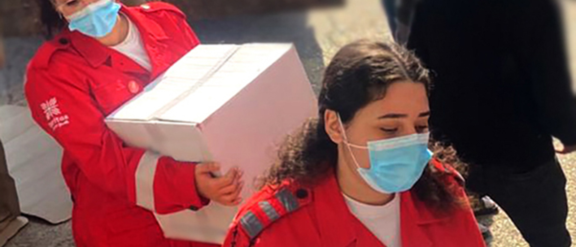 Aid workers carry boxed of aid on the 2nd of March photo credit Caritas Lebanon.jpg