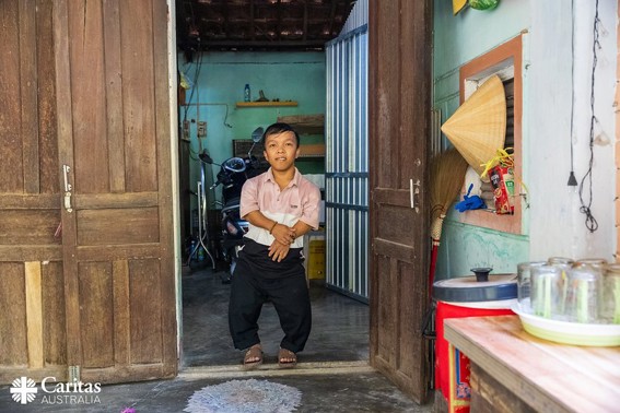 Lam Standing In His Family Home In Vietnam