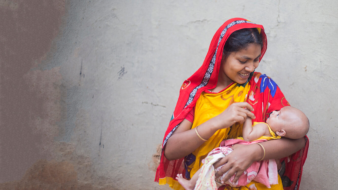 Woman holding baby in Bangladesh