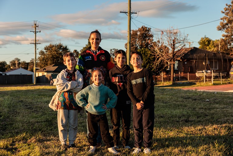 Tereesa with her children near her home in western Sydney. Photo: Richard Wainwright/Caritas Australia