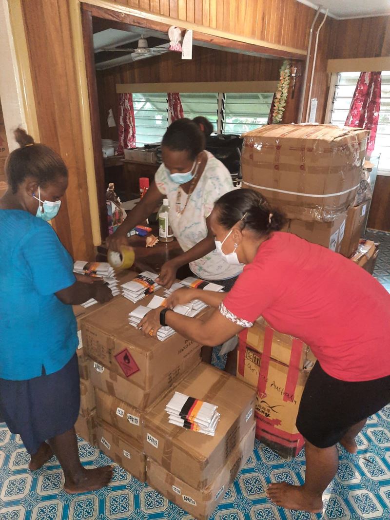 Staff preparing care kits in Solomon Islands