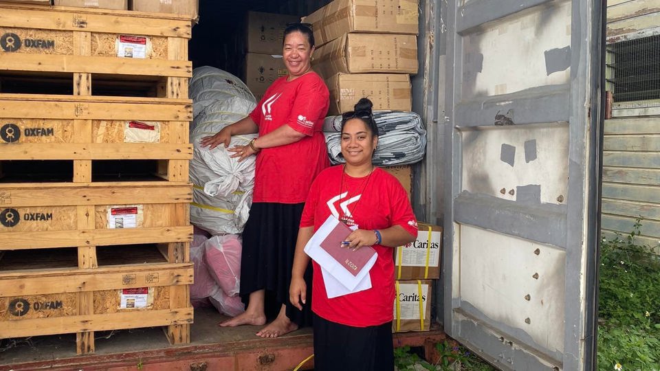 Caritas Tonga staff pre-positioning supplies