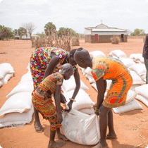 East Africa Food Crisis Siblings Assist Each Other To Carry A Sack Of Food Received
