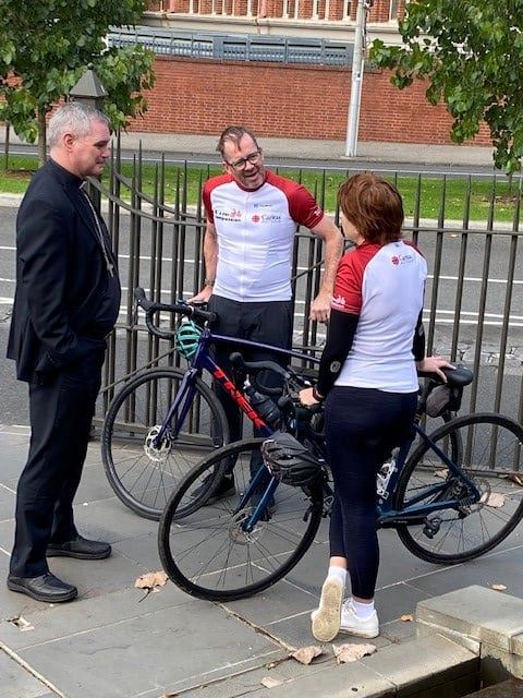 Kirsty and Richard being welcomed to Melbourne by Archbishop Comensoli after their cycle from Sydney to Melbourne to end global poverty.
