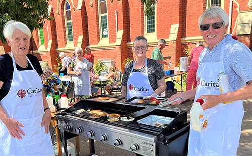 Parishioners flip pancakes for Project Compassion. Photo: Caritas Australia
