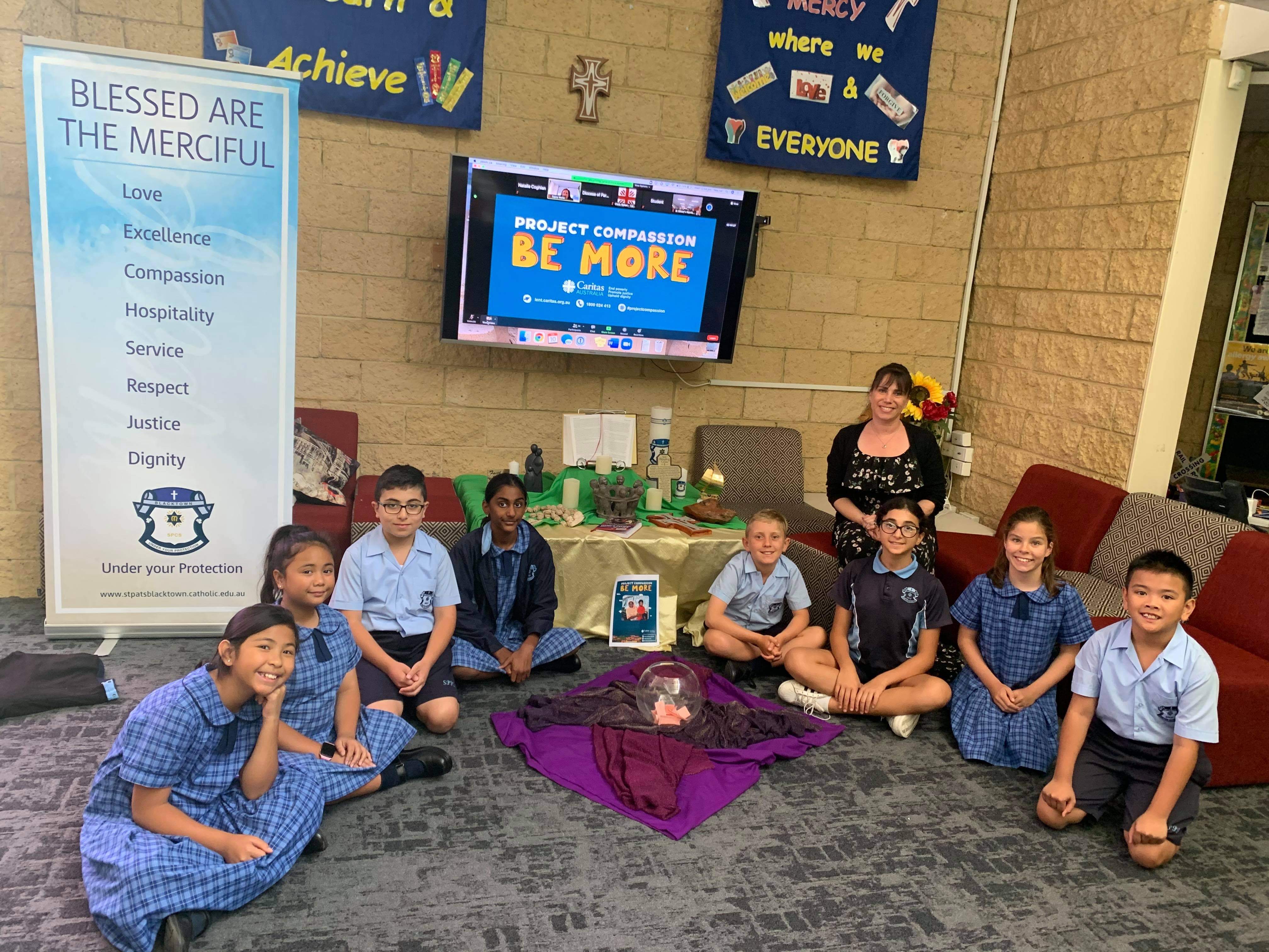 Primary School students celebrating Project Compassion