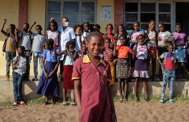 Anatercia with other students in front of her local school in her village in Mozambique. Photo credit: Emidio Josine/Caritas Australia.