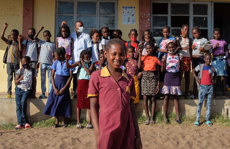 Anatercia with other students in front of her local school in her village in Mozambique. Photo credit: Emidio Josine/Caritas Australia.