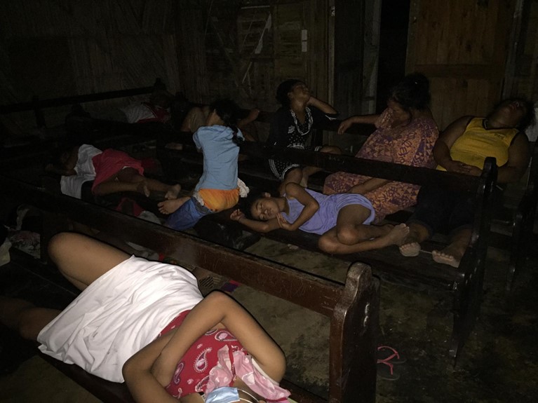 Families seek shelter inside a chapel following the volcanic eruption and tsunami in Tonga. Photo: Pauline Bourke/Caritas Tonga