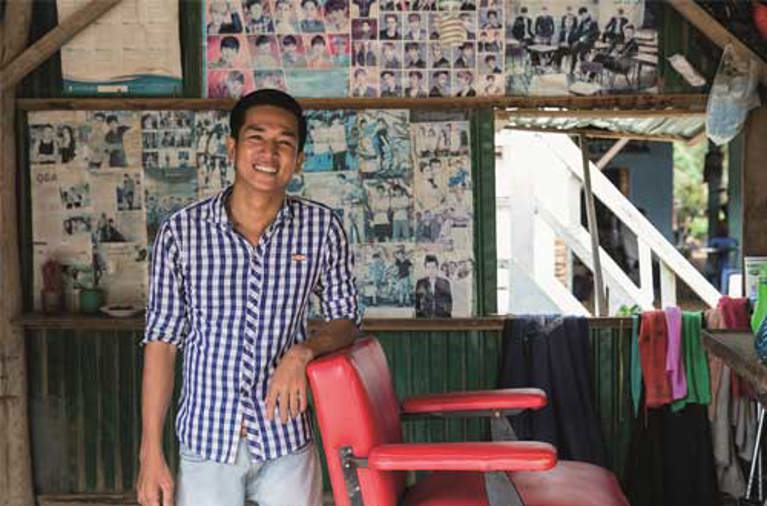 Rattanak now runs his own barber shop after participating in the Deaf Development Programme. Photo Credit: Richard Wainwright/Caritas Australia