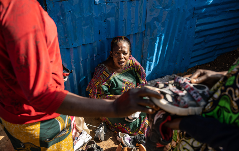 Rosalie sits on the floor in the Democratic Republic of Congo. Credit: Arlette Bashizi/CAFOD