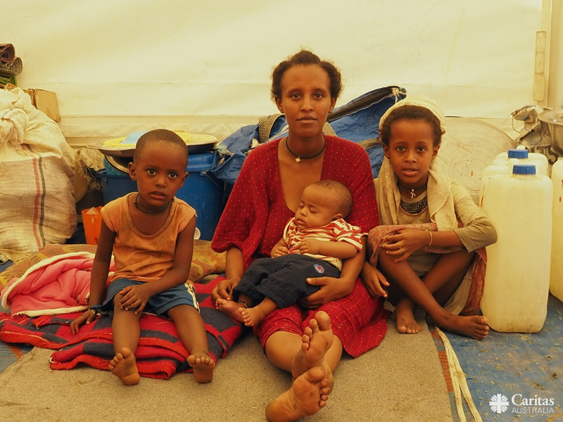 Woman With Her Family In IDP Camp In Northern Ethiopia. Photo Caritas Australia 2