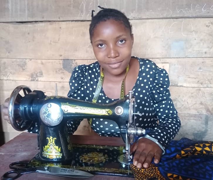 Rachel learnt how to sew and is now earning an income as a seamstress. Photo: Caritas Goma