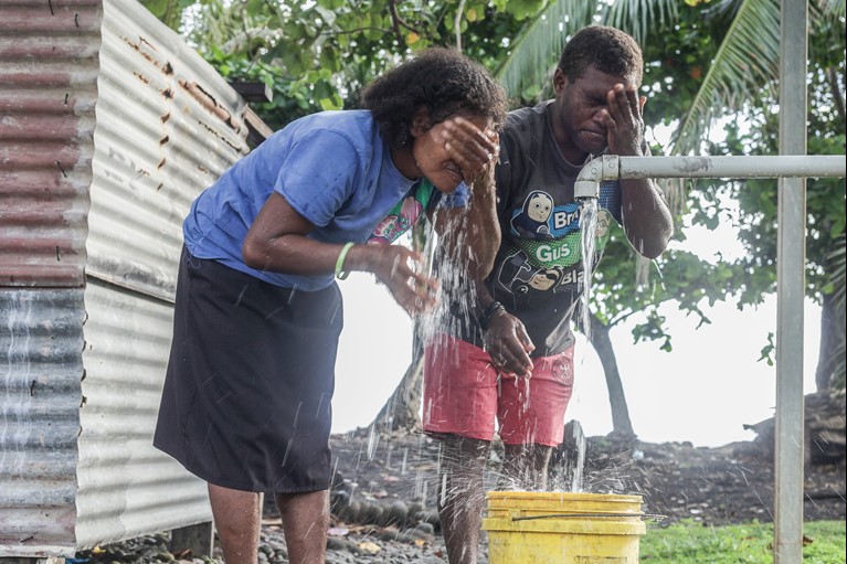 Margret (left) at the San Isidro Care Centre in Guadalcanal province, Solomon Islands, October 2020. Due to drought, the school faced water shortages for about half the year with staff and students walking off campus, twice a day, to collect water. With Caritas Australia’s support, Margret’s school was able to install eight large water tanks, and a rainwater harvesting system, enabling the school to catch and store sufficient drinking water to supply students and staff throughout the entire year. It also allowed them to expand their vegetable and poultry production increasing their food security. Photo credit: Neil Nuia/Caritas Australia.