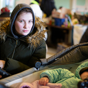 Woman In Ukraine With Her Baby