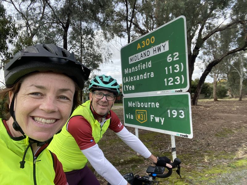 Kirsty and Richard with the sign for Melbourne in sight. Photo: Caritas Australia.