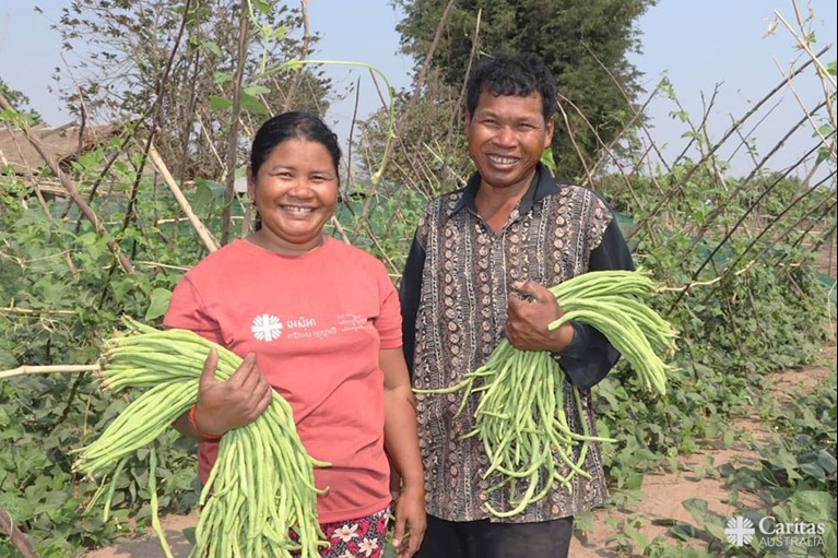 Through your support, Em and Lat can now grow crops on their farm all-year round. Photo: Sam Rinang.
