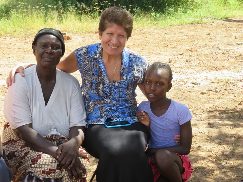 Sr Ivy Khoury Of Caritas Australia (Centre) With Thandolwayo (Right) And Her Grandmother (Left) In Zimbabwe. Photo Richard Wainwright Caritas Australia.