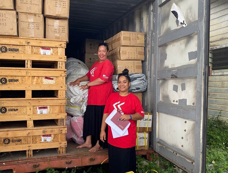 Caritas Tonga staff unloading supplies. Photo credit: Caritas Tonga.
