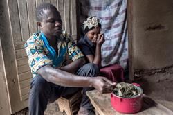 Ebola Survivors Katongo And Brother Kambale 24 Eat Meal Made From Food Provided By Caritas At Their Home In The Ebola Hit Town Of Magina