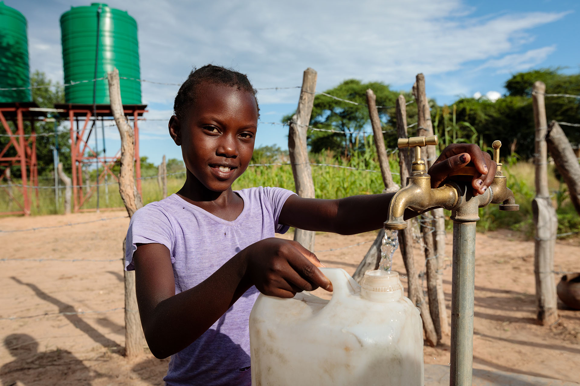 Thandolowayo Filling A Water Can