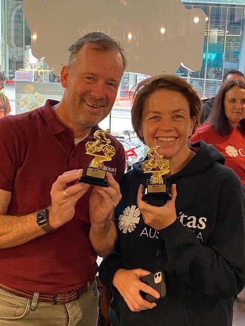 Kirsty And Richard With Trophies After They Completed Their Bike Ride From Sydney To Melbourne. Photo Caritas Australia