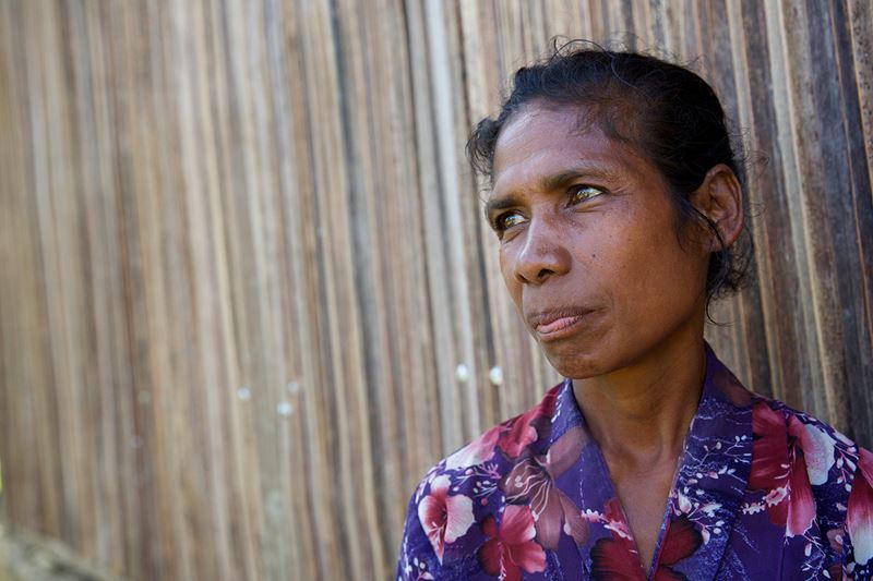 Martina standing outside a house in Timor-Leste