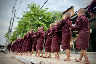 Koyins Novice Monks Participate In The Early Morning Alms Round In Yangon Photo Credit Benny Manser For CRS