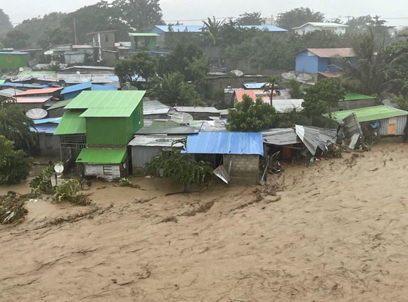 Houses swept away by an overflowing Comoro River. Photo: Dan Convoy/CRS
