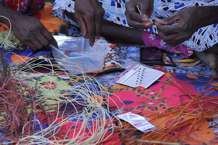 A local weaving workshop at Djilpin Arts in NT. Photo: Cassandra Hill/Caritas Australia. 