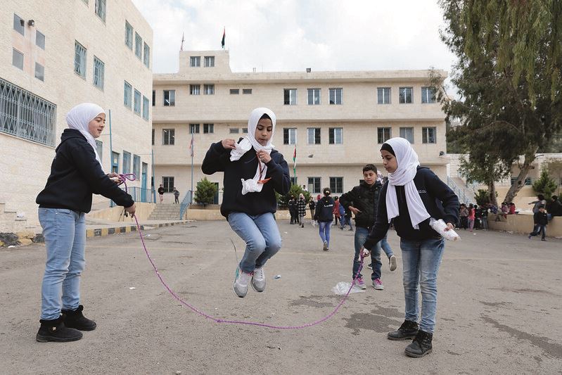 Girls skipping rope in Jordan